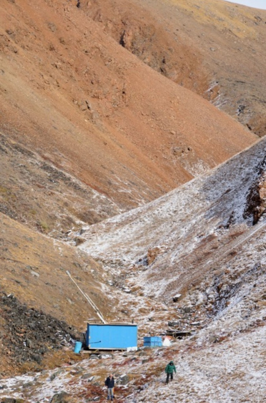 Field camp in the Sarfartoq valley with an early snowfall on the slopes