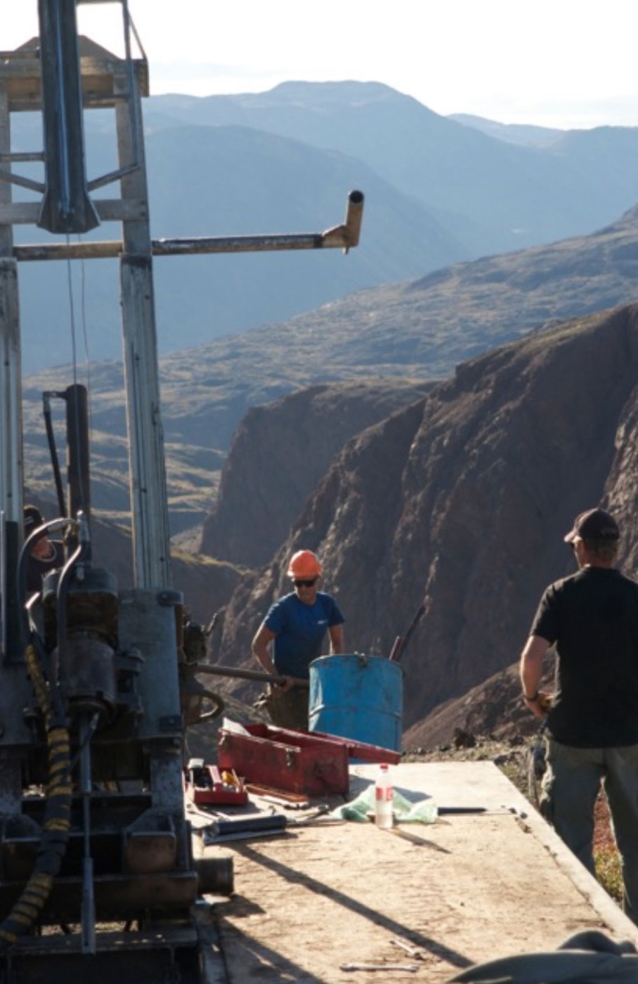 Drill rig and crew on a platform above the Sarfartoq valley